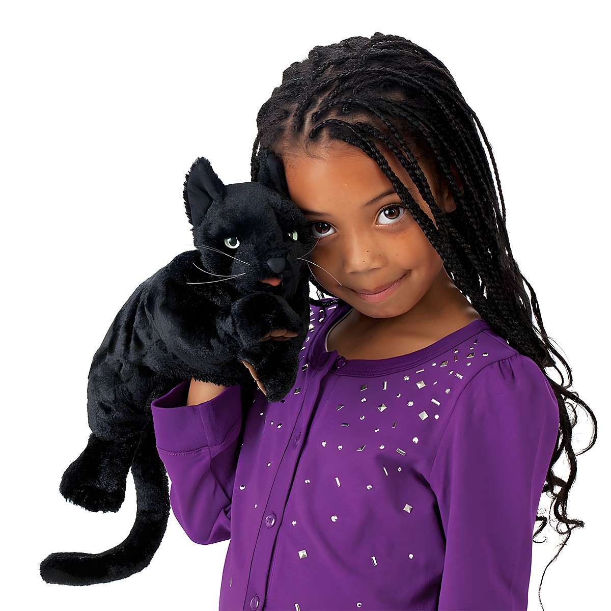 Girl holding up a Folkmanis black cat hand puppet with green eyes and white whiskers