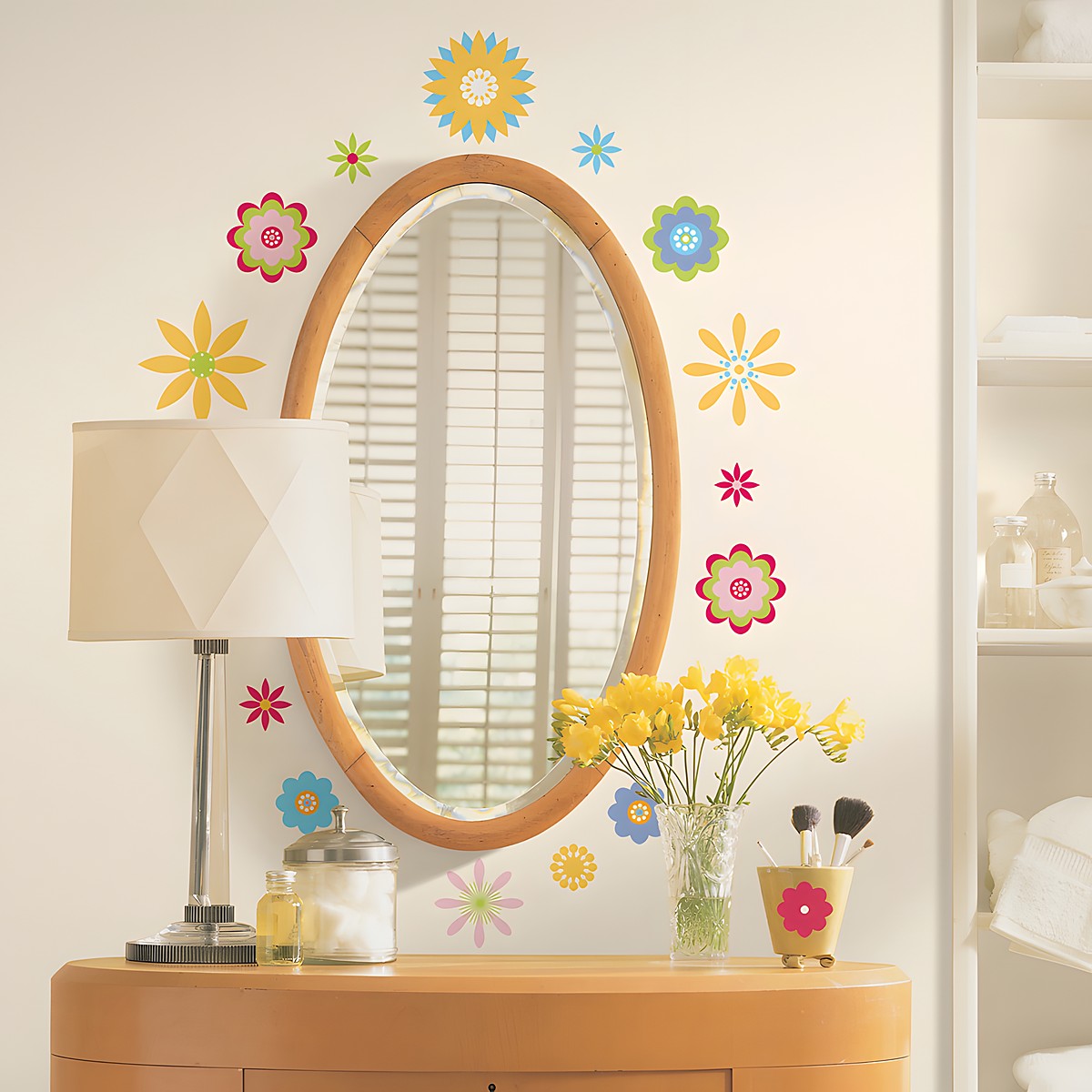 RoomMates wall decal Graphic Flowers Peel & Stick, colourful graphic flower motifs around an oval mirror above a chest of drawers
