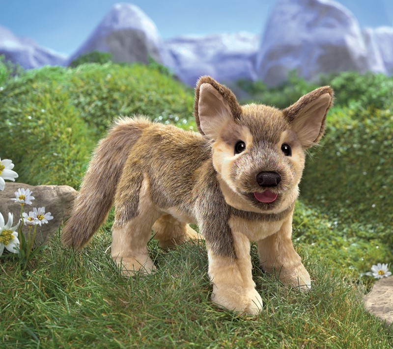 Folkmanis hand puppet German Shepherd puppy with beige-brown fur, tongue sticking out and pointed ears, standing in side view