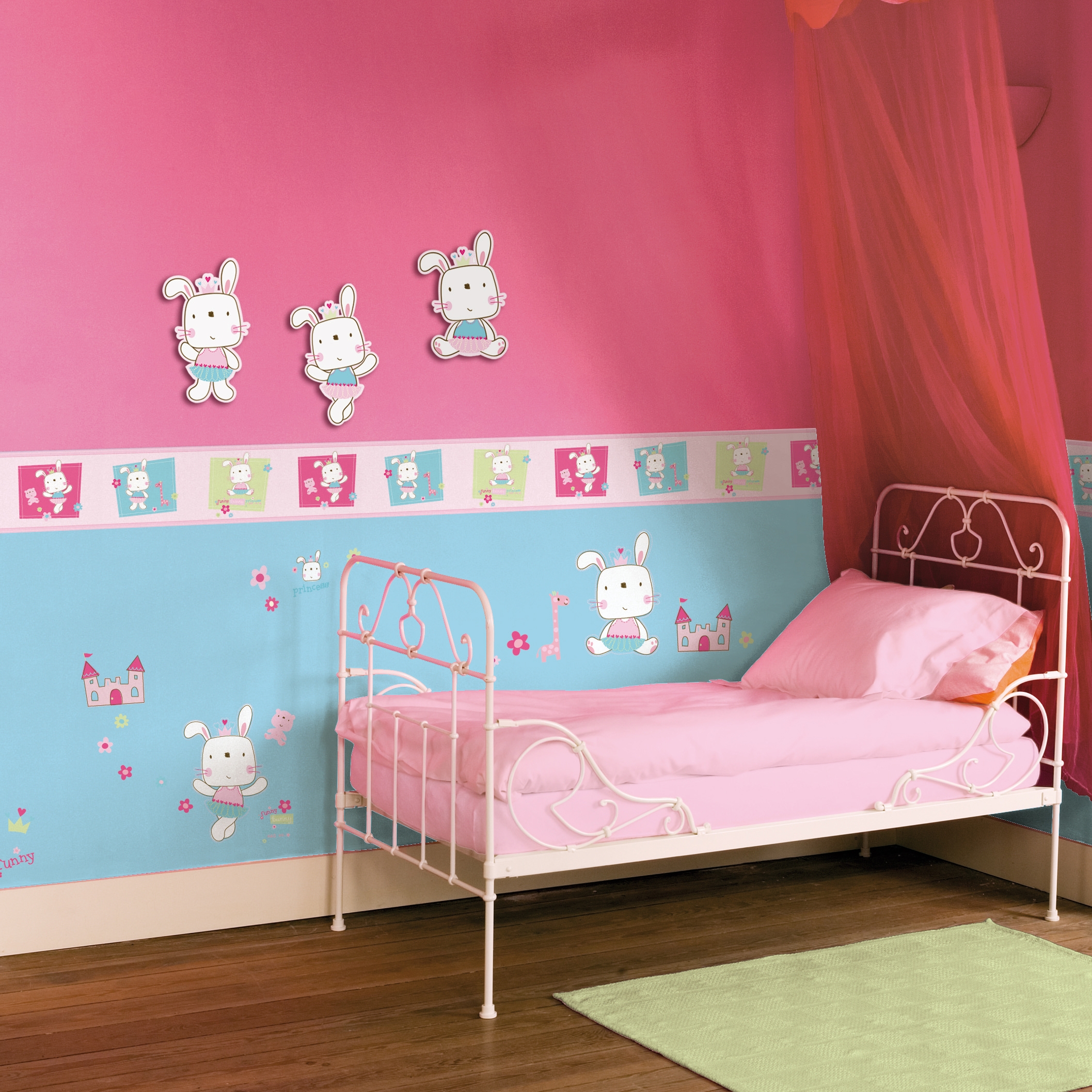 decofun wall decal Funny Bunny lifestyle photo, three bunnies above the border on a pink wall with a canopy bed