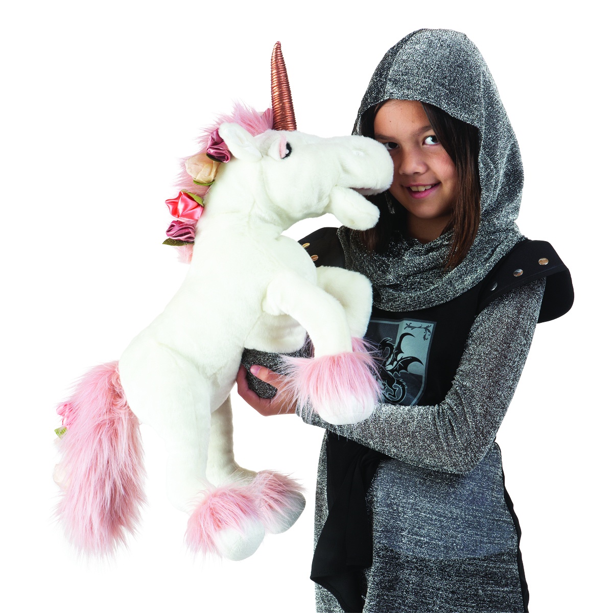 Girl in a silver knight costume holding up a white Folkmanis unicorn hand puppet with a pink mane and gold horn