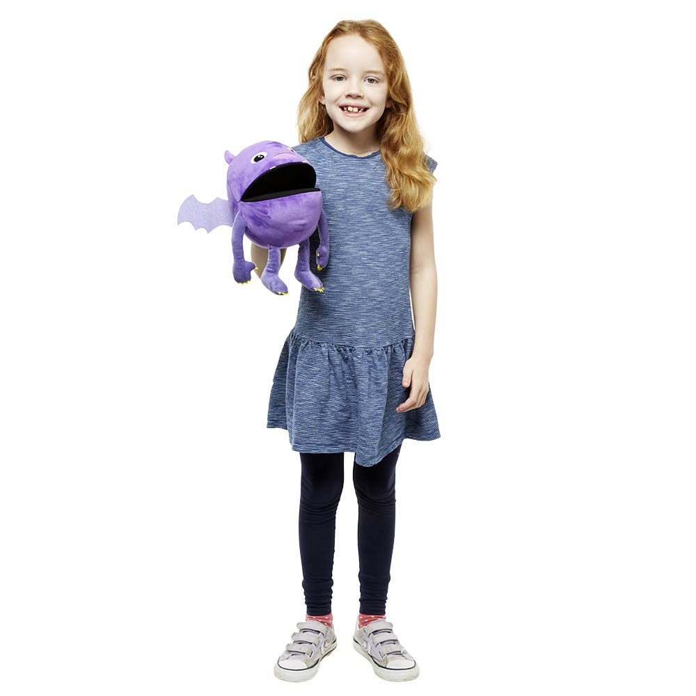 Girl holding the The Puppet Company purple baby monster hand puppet on her arm, usage example