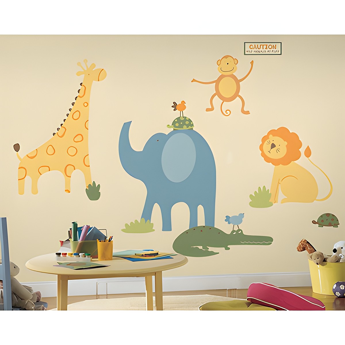 RoomMates wall decal Zoo Animals, giraffe, elephant, lion and monkey with a warning sign on a cream-coloured children's room wall above a table