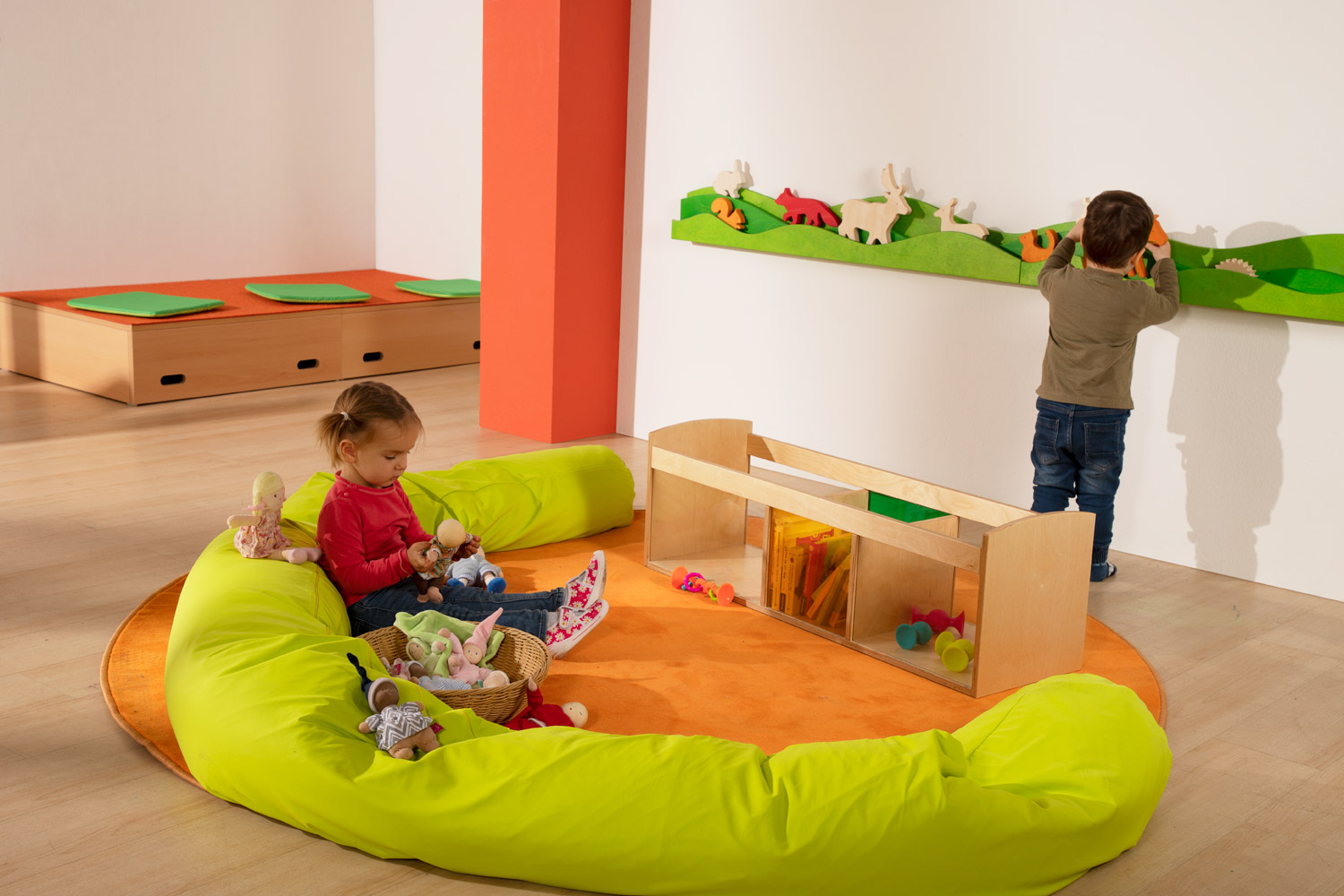 Children playing with the Joyk Treasure Basket set in a play corner with wall shelf