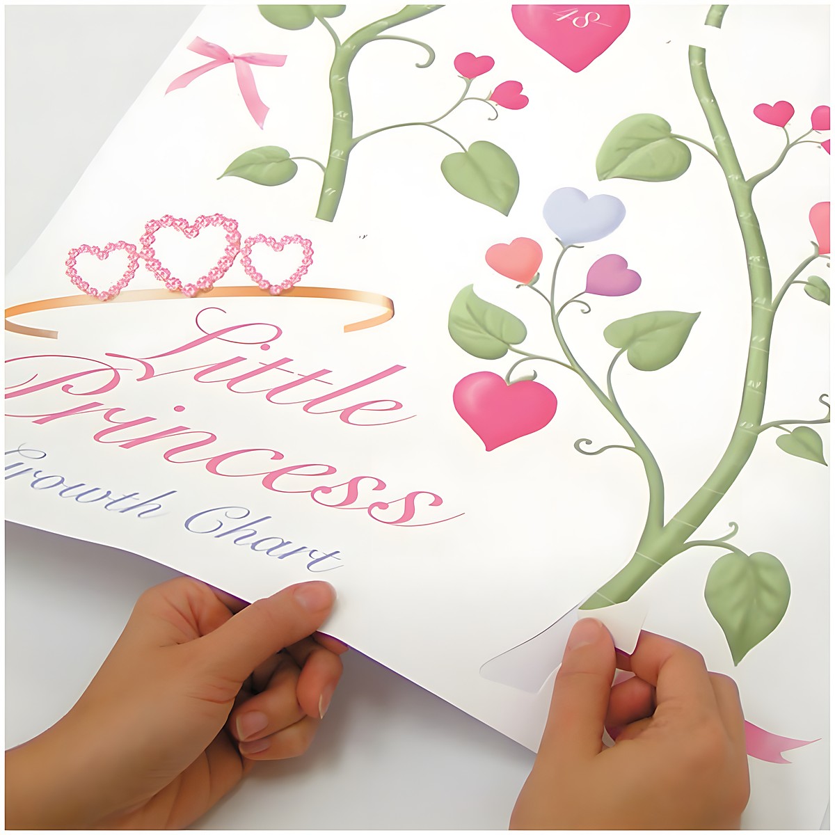 RoomMates growth chart Little Princess, climbing heart-blossom vine growth chart with ribbons on a pink children's room wall next to a curtain