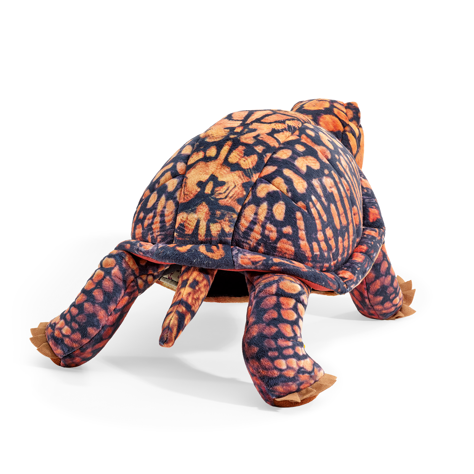 Folkmanis box turtle hand puppet in orange and black with a textured shell, shown from a rear-angled top view