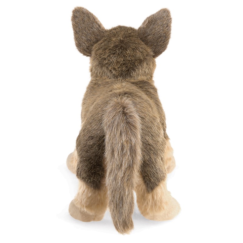 Folkmanis German Shepherd puppy hand puppet seen from behind, seated plush toy with brown-beige fur and upright ears