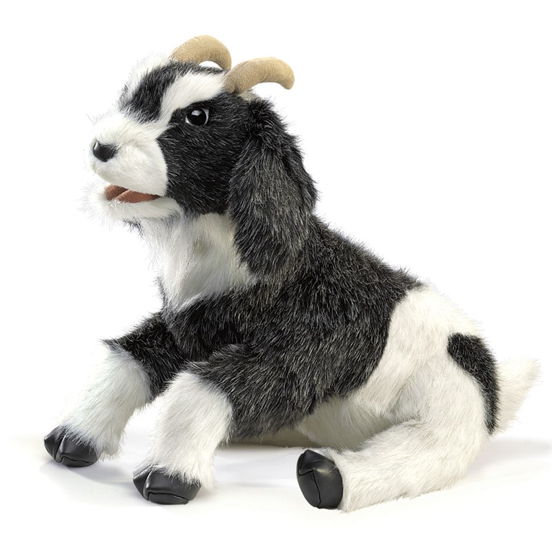 Folkmanis Handpuppe Ziege mit schwarz-weißem Fell, geschwungenen Hörnern und geöffnetem Maul, sitzend in Seitenansicht