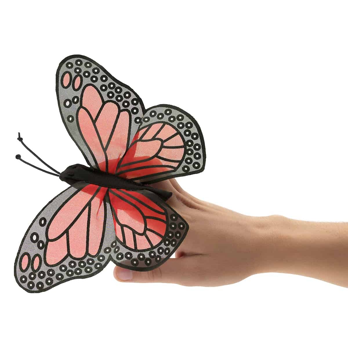 Folkmanis Fingerpuppe mini Monarchschmetterling mit rosa-schwarzen Flügeln, auf einem Finger gesteckt, Seitenansicht