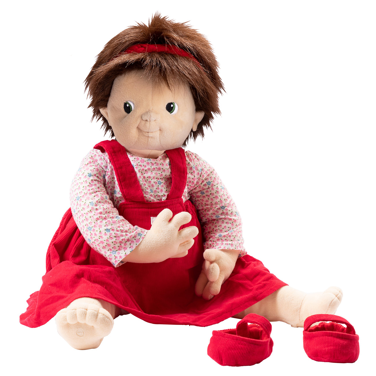 Joyk Empathiepuppe Ingrid mit rotem Haarband, geblümtem Shirt, rotem Latzkleid und Schühchen, sitzend