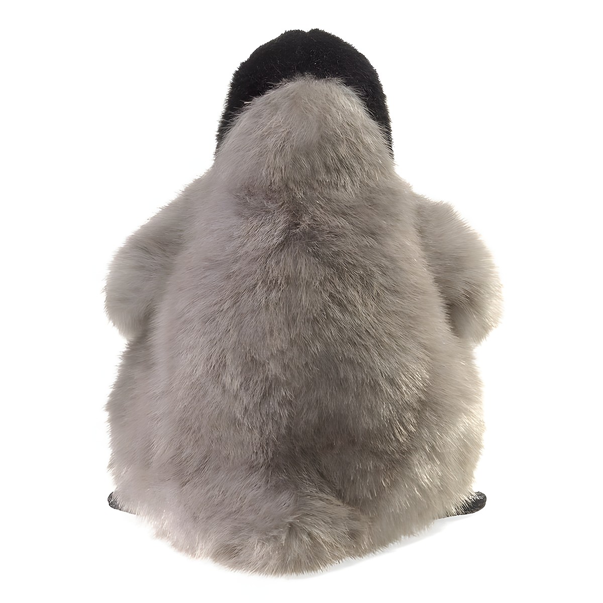 Folkmanis Baby Emperor Penguin hand puppet seen from behind: fluffy grey plumage, black cap on head, sitting pose