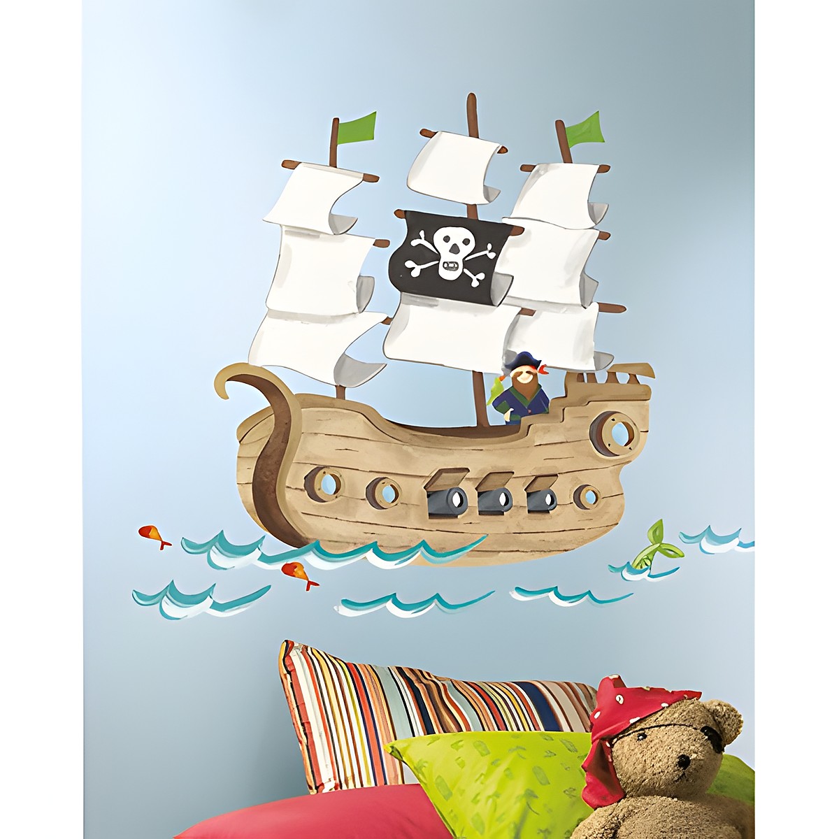 RoomMates wall decal Pirate Ship, pirate ship with a skull flag and captain on a light blue children's room wall above a striped sofa