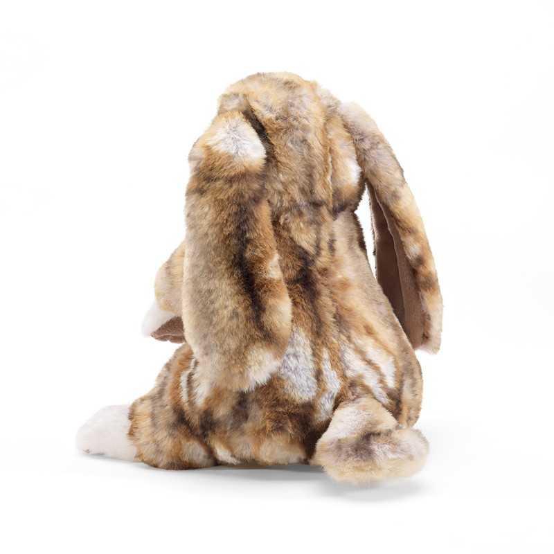 Folkmanis lop-eared rabbit hand puppet seen from behind, brown and white spotted plush fur, long drooping ears
