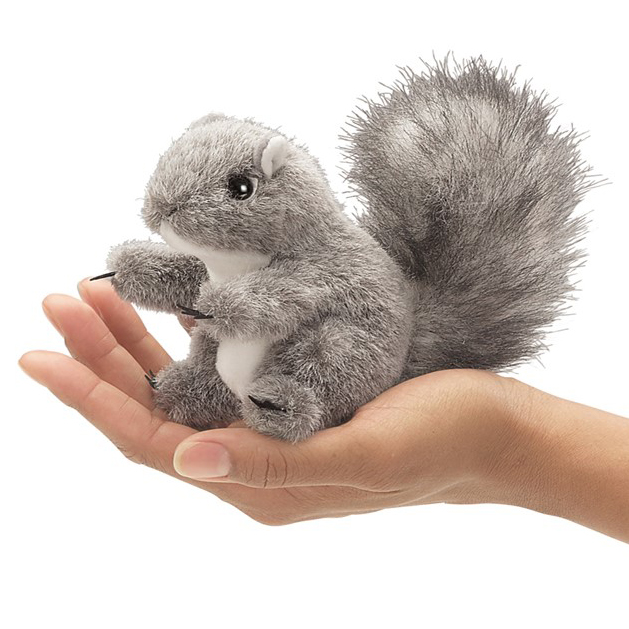Folkmanis mini grey squirrel finger puppet sitting upright on a palm with a bushy tail