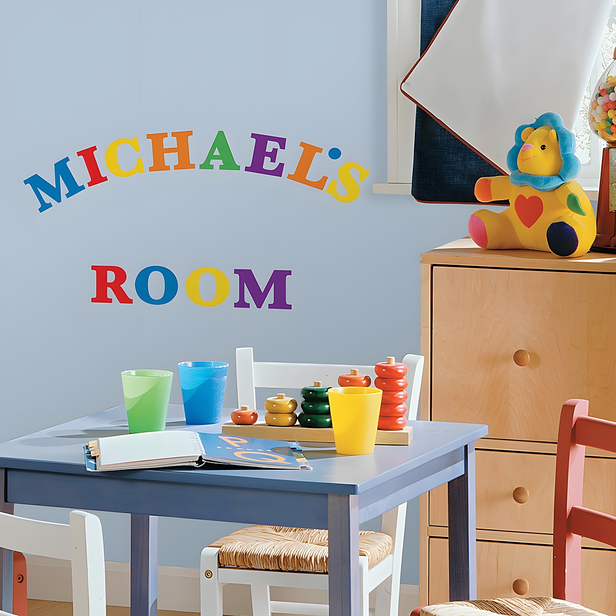 RoomMates Wandsticker Colourful Alphabet, bunte Buchstaben als Namenszug „Michael's Room“ an einer hellblauen Kinderzimmerwand