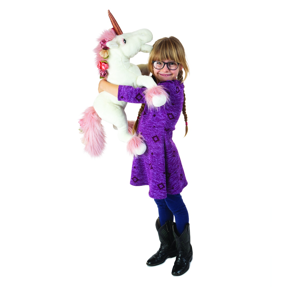 Girl holding up a large Folkmanis unicorn hand puppet with white plush, pink mane and golden horn