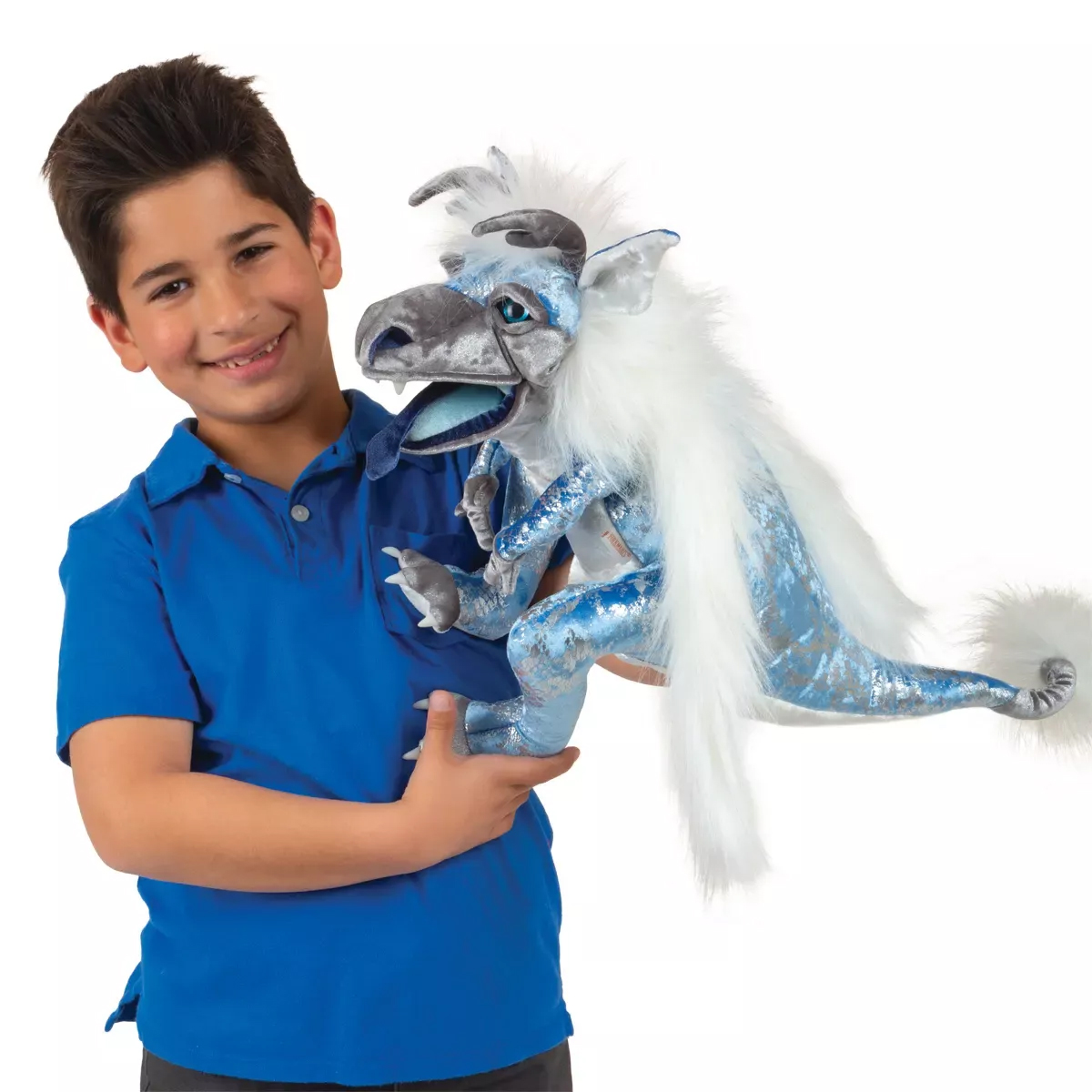 Boy holding a Folkmanis ice dragon hand puppet with a blue-silver scale pattern, white mane and movable mouth
