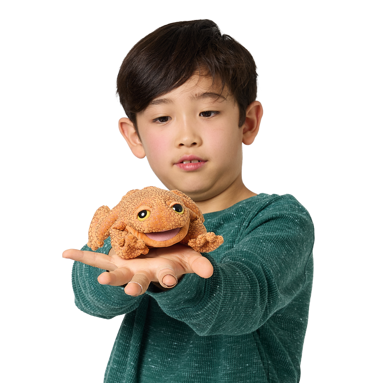Folkmanis mini finger puppet toad in orange-brown with a textured surface, presented on a child's hand