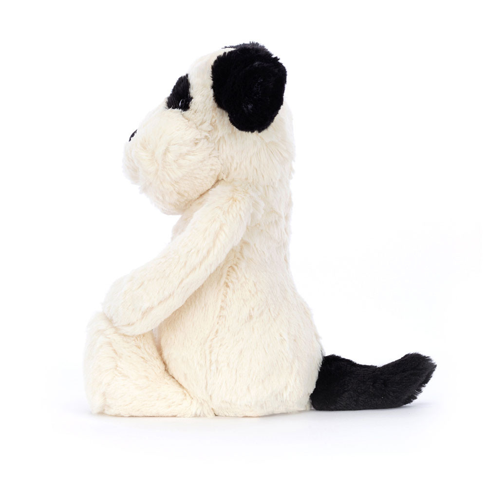 Jellycat Kuscheltier Bashful Puppy Black Cream, sitzender Hundewelpe mit schwarzen Ohren, Seitenansicht