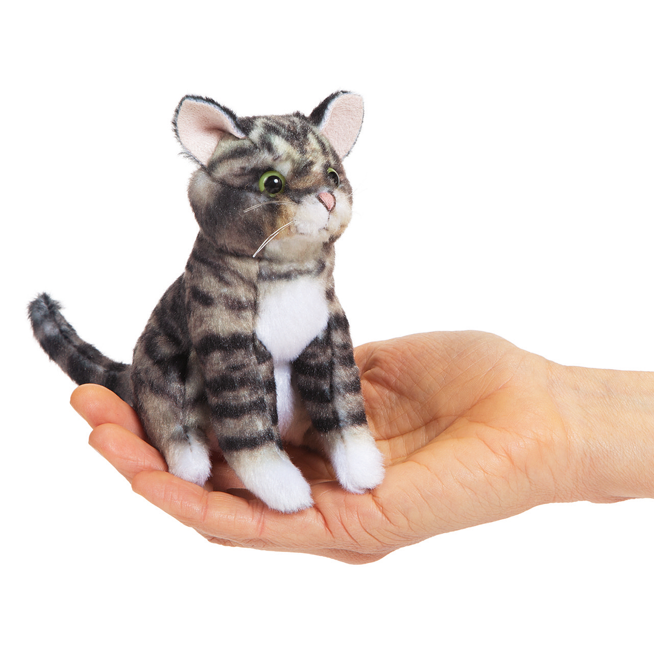 Folkmanis mini tabby cat finger puppet sitting upright on a palm, grey-black striped with green eyes and a white belly