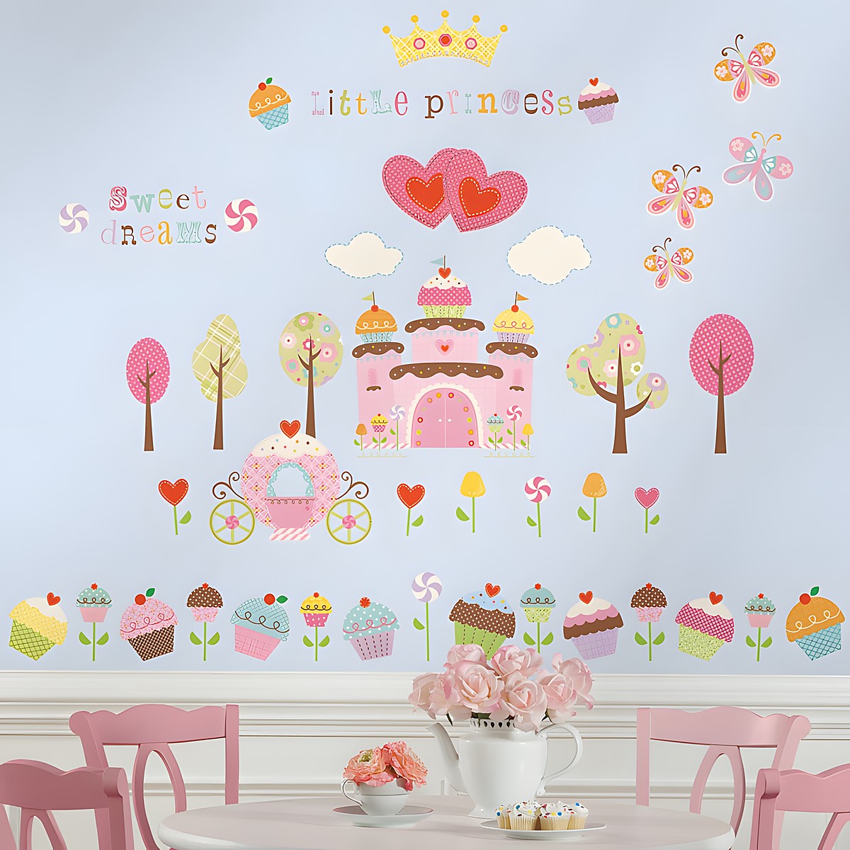 RoomMates wall decal Cupcake Castle, castle and cupcake motifs with "Little Princess" lettering and butterflies on a light blue children's room wall above a table