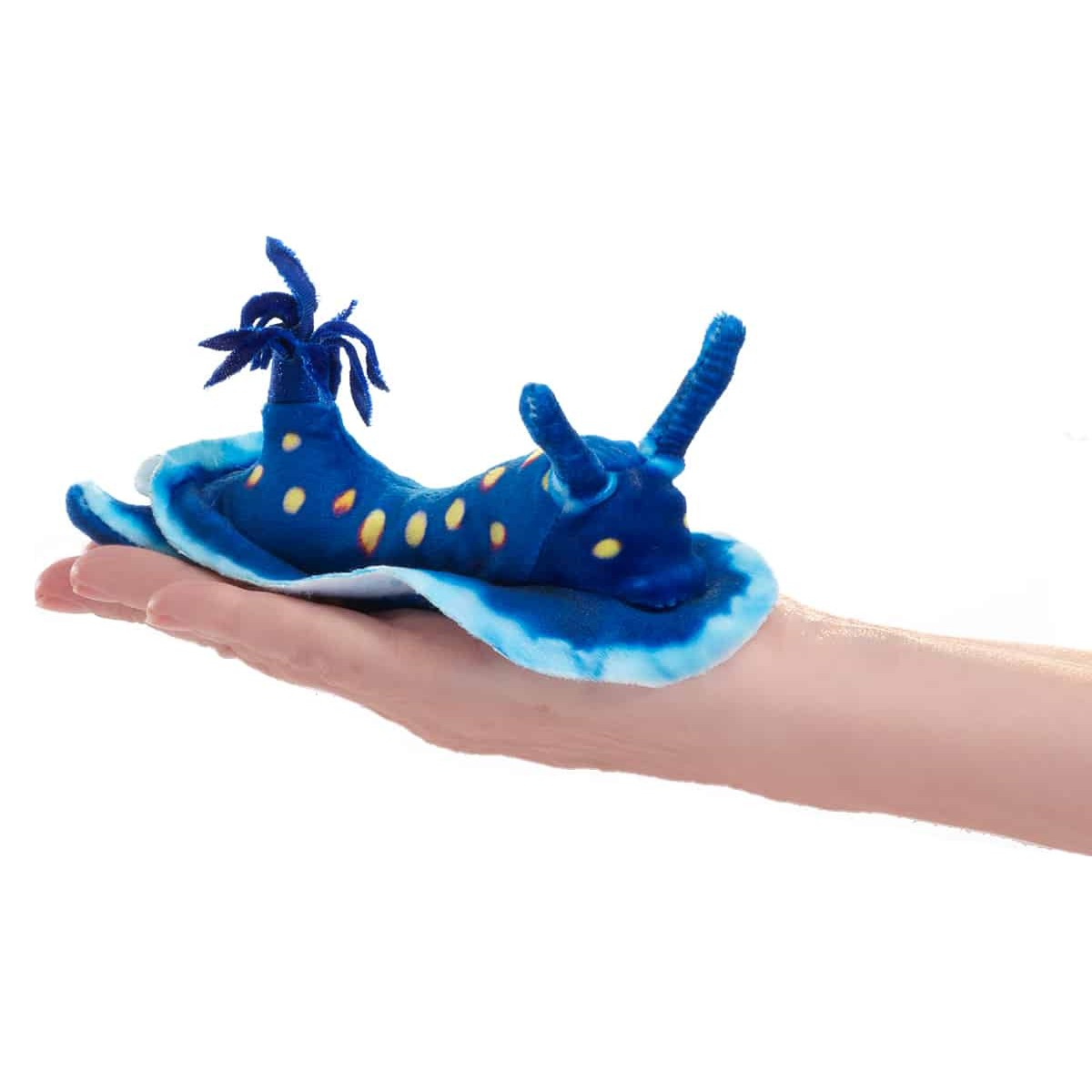 Folkmanis mini ocean slug finger puppet in vivid blue with yellow spots, lying on a palm