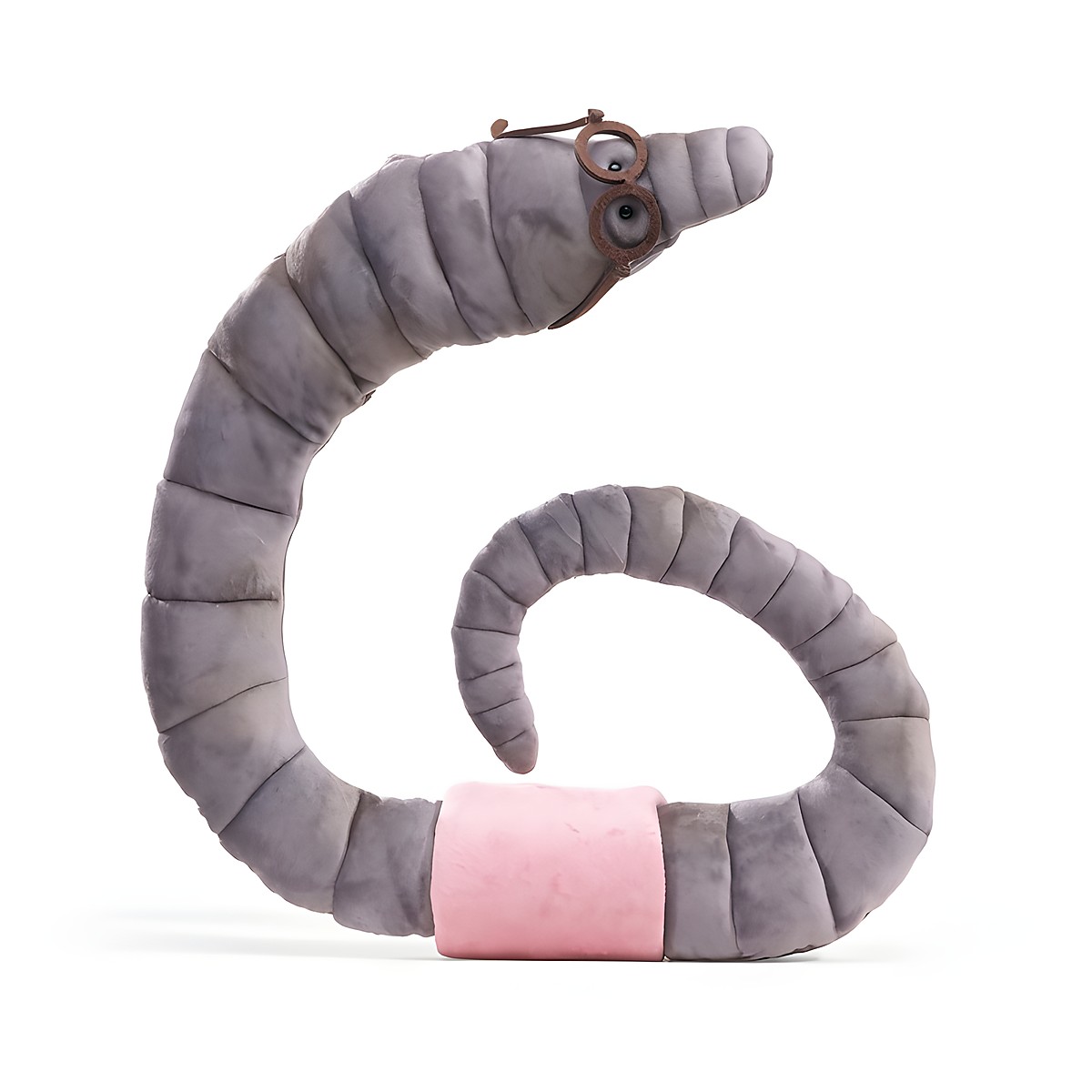 Folkmanis bookworm hand puppet in grey plush with a pink belt and brown wire-frame glasses, coiled in a spiral shape