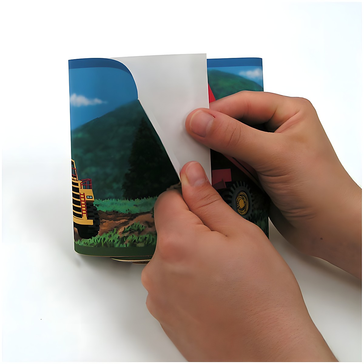 RoomMates border Under Construction, hands folding the border strip with a construction vehicle motif, usage example