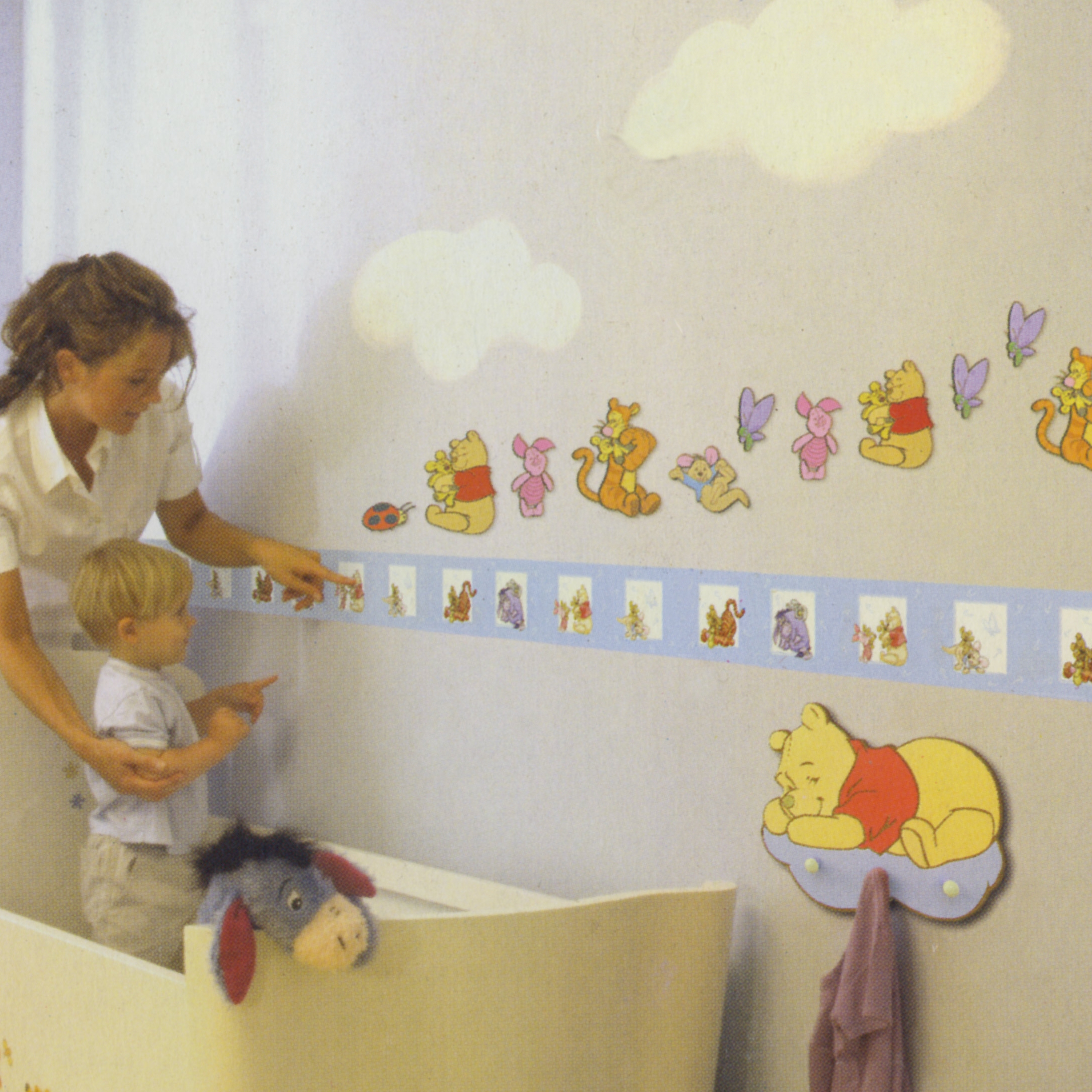 decofun wall decoration Winnie the Pooh Baby in a nursery, border above a cot and a wall hook with Winnie the Pooh sleeping on a moon