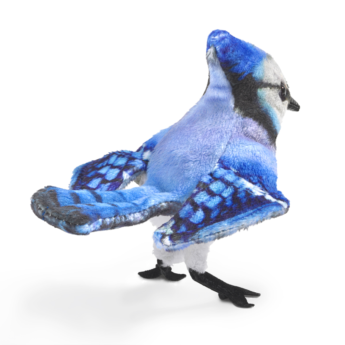 Folkmanis mini blue jay finger puppet with blue-and-white patterned plumage and black feet, shown at an angle