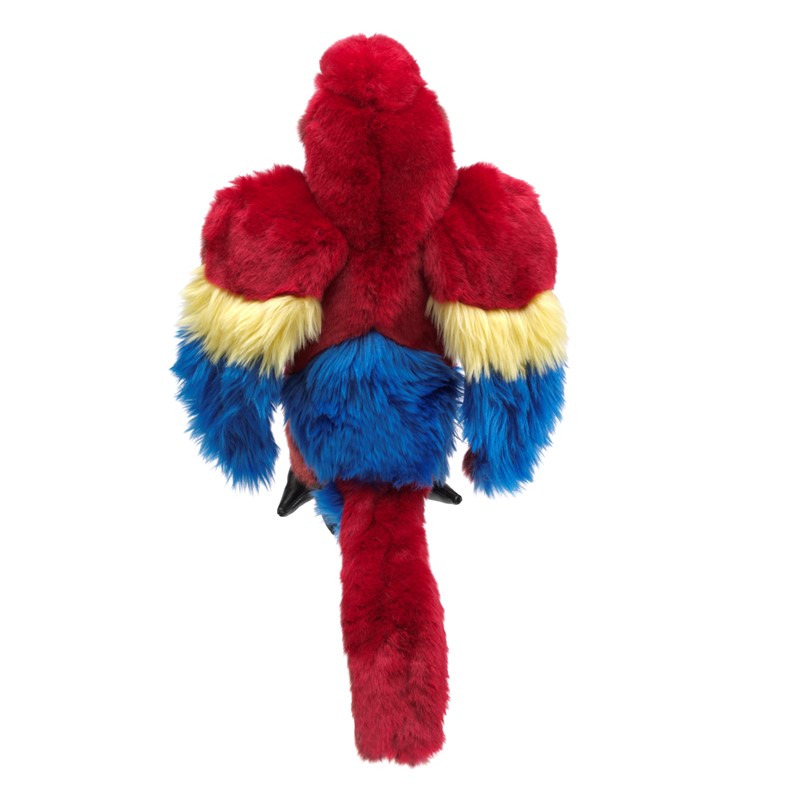 Folkmanis Handpuppe Ara von oben, leuchtend rotes Plüschgefieder mit gelb-blauen Flügeln und langem rotem Schwanz.