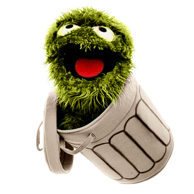 Living Puppets hand puppet Oscar from Sesame Street with an open red mouth, peeking out of the tilted rubbish bin