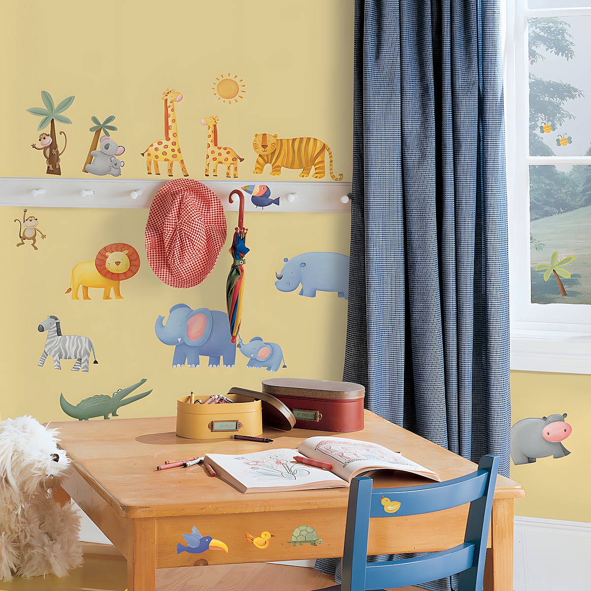 RoomMates wall decal Jungle Adventure, jungle animals such as monkeys, giraffe, tiger, lion and elephants on a yellow children's room wall with coat hooks