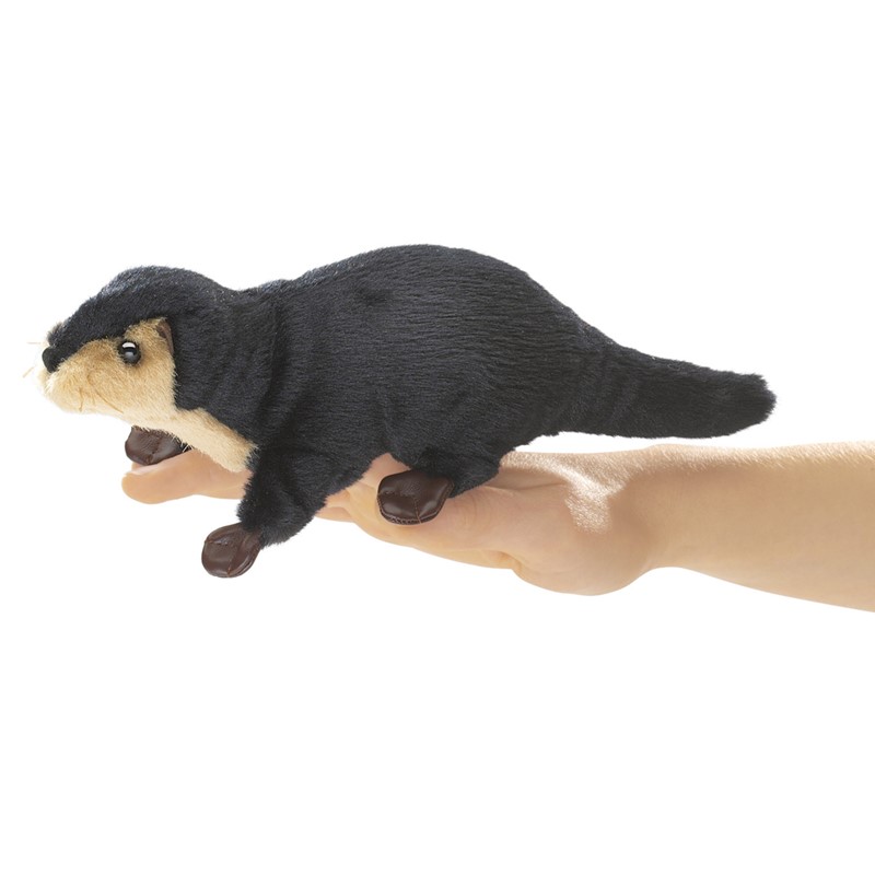 Folkmanis mini river otter finger puppet in black and beige, shown from the side on a hand