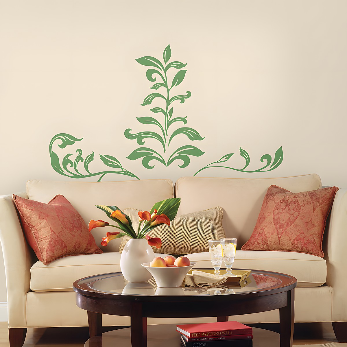 RoomMates wall decal Leaf Scroll Peel & Stick, green leaf vine motif on a cream-coloured wall above a sofa