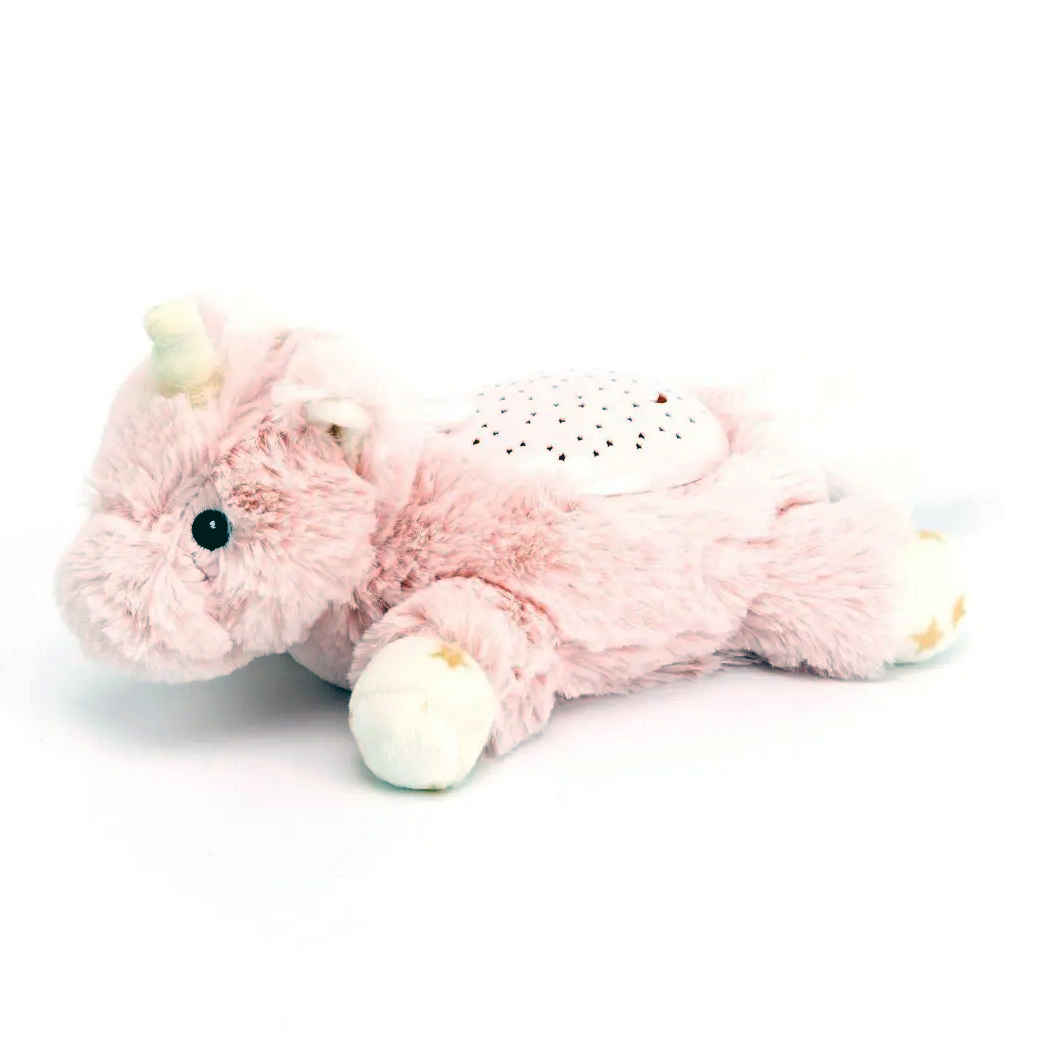 Cloud b sleep aid Dream Buddies unicorn, pink plush toy lying down with LED star projector on back, side view