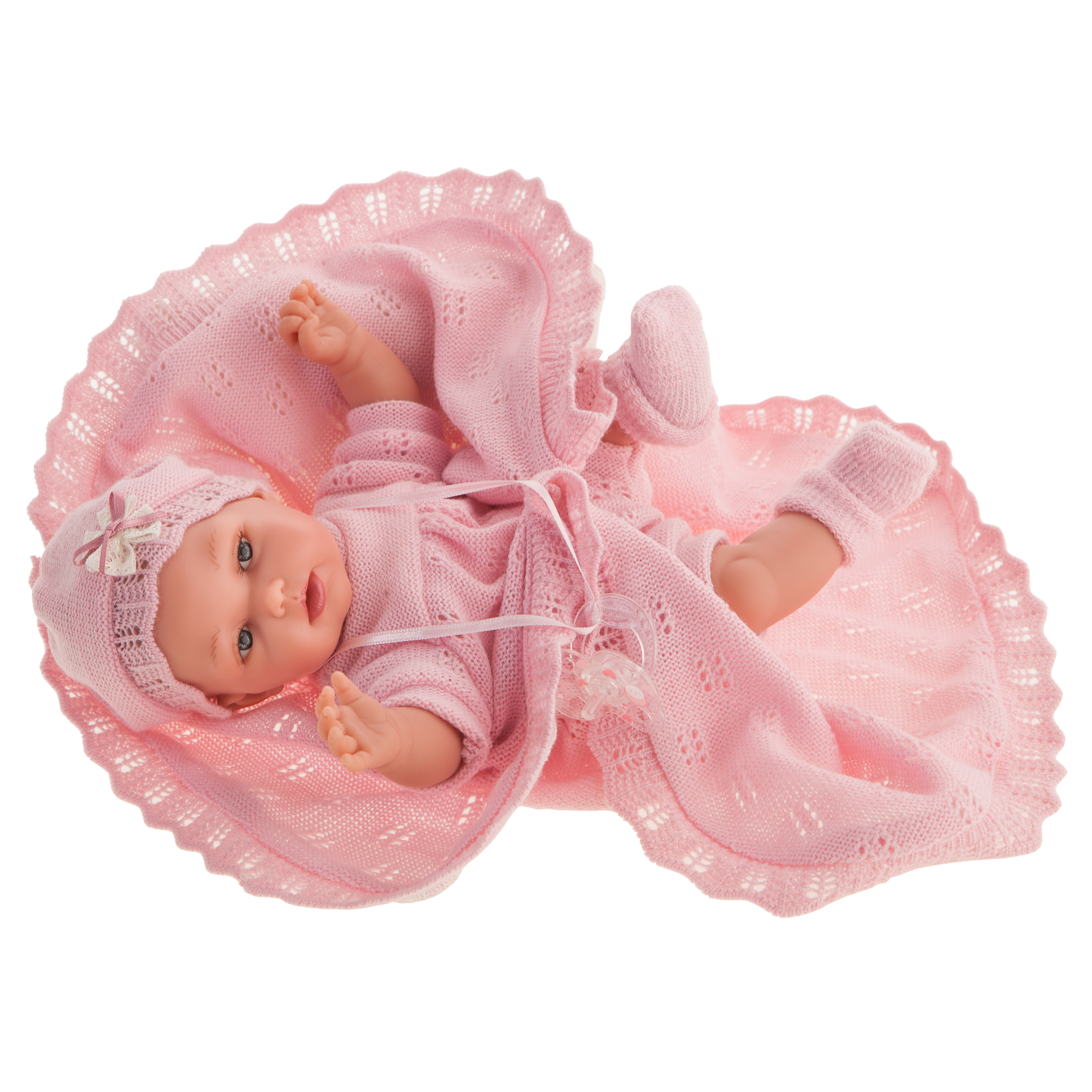 Antonio Juan Babypuppe Peke, realistische Puppe im rosa Strickset mit Mütze und Söckchen, liegend auf ausgebreiteter rosa Kuscheldecke