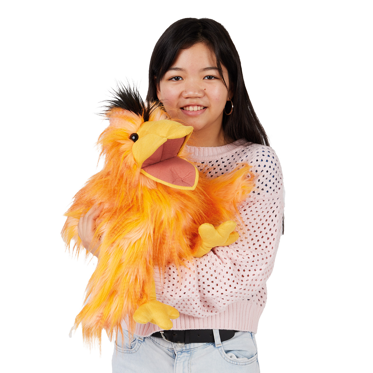 Folkmanis hand puppet silly bird in orange with open beak and black crest, operated on the arm of a young woman
