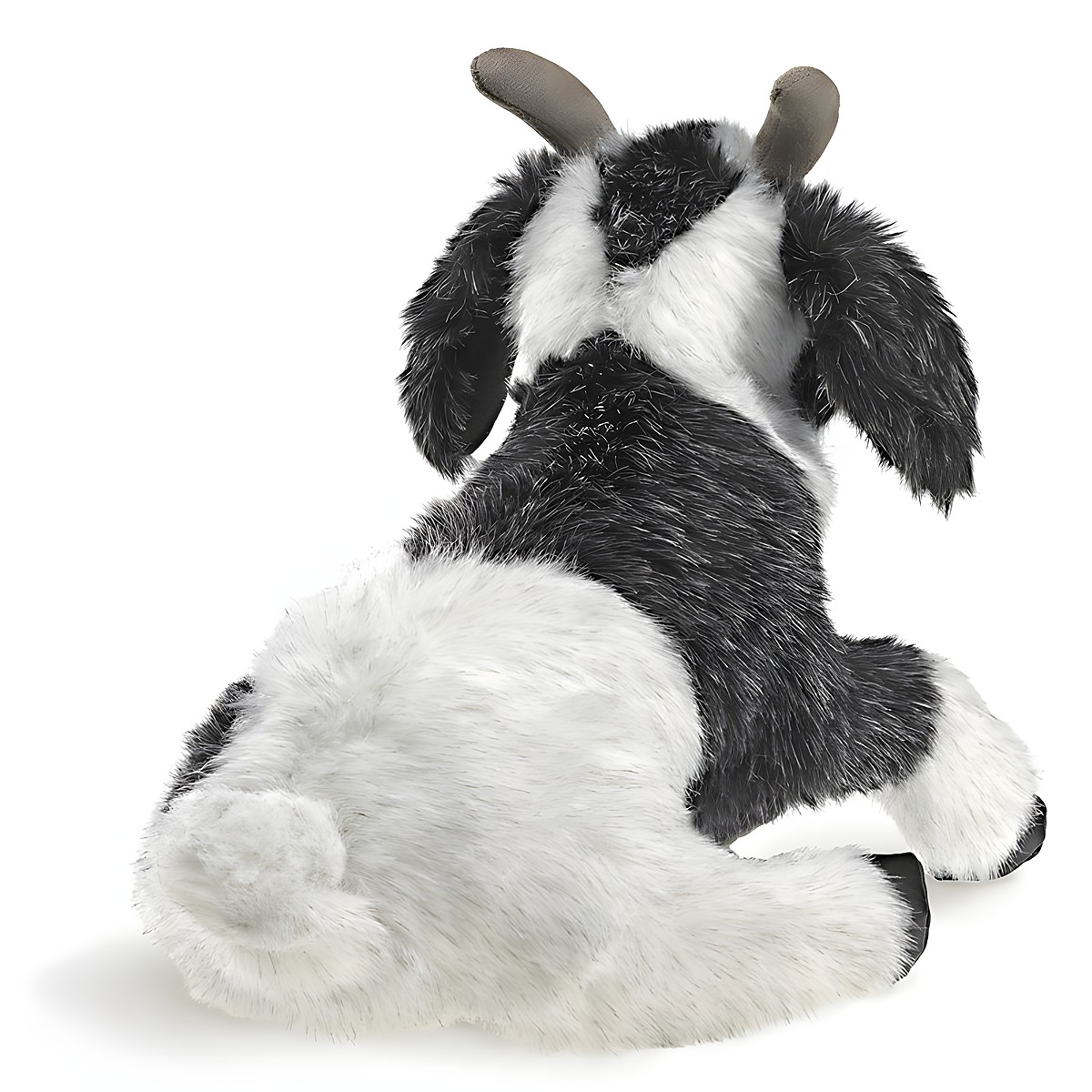 Folkmanis Handpuppe Ziege in Schwarz-Weiß, liegend von hinten, mit graubraunen Hörnern und zottigem Fell