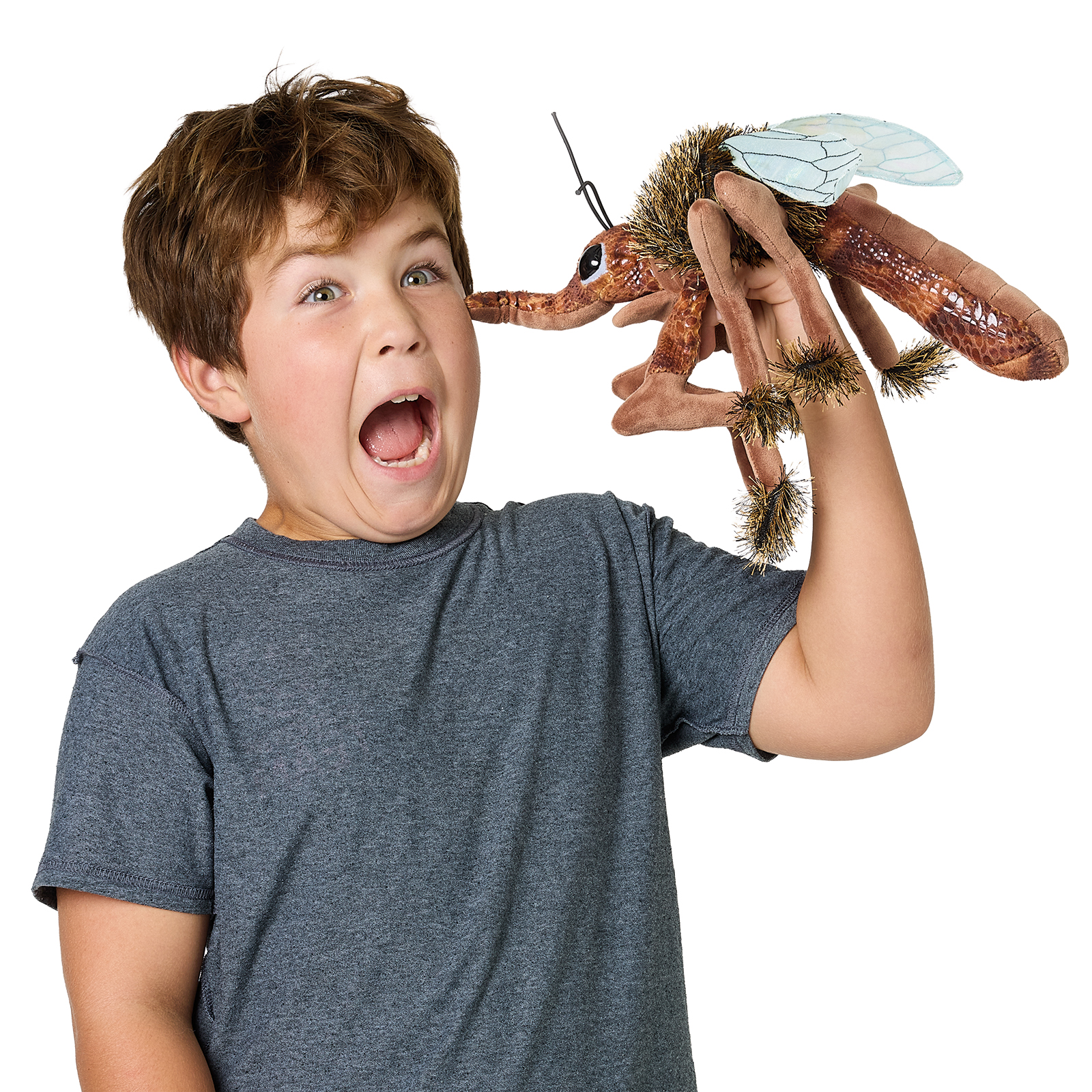 Boy holding a Folkmanis mosquito hand puppet with transparent wings, brown plush body and antennae up in the air