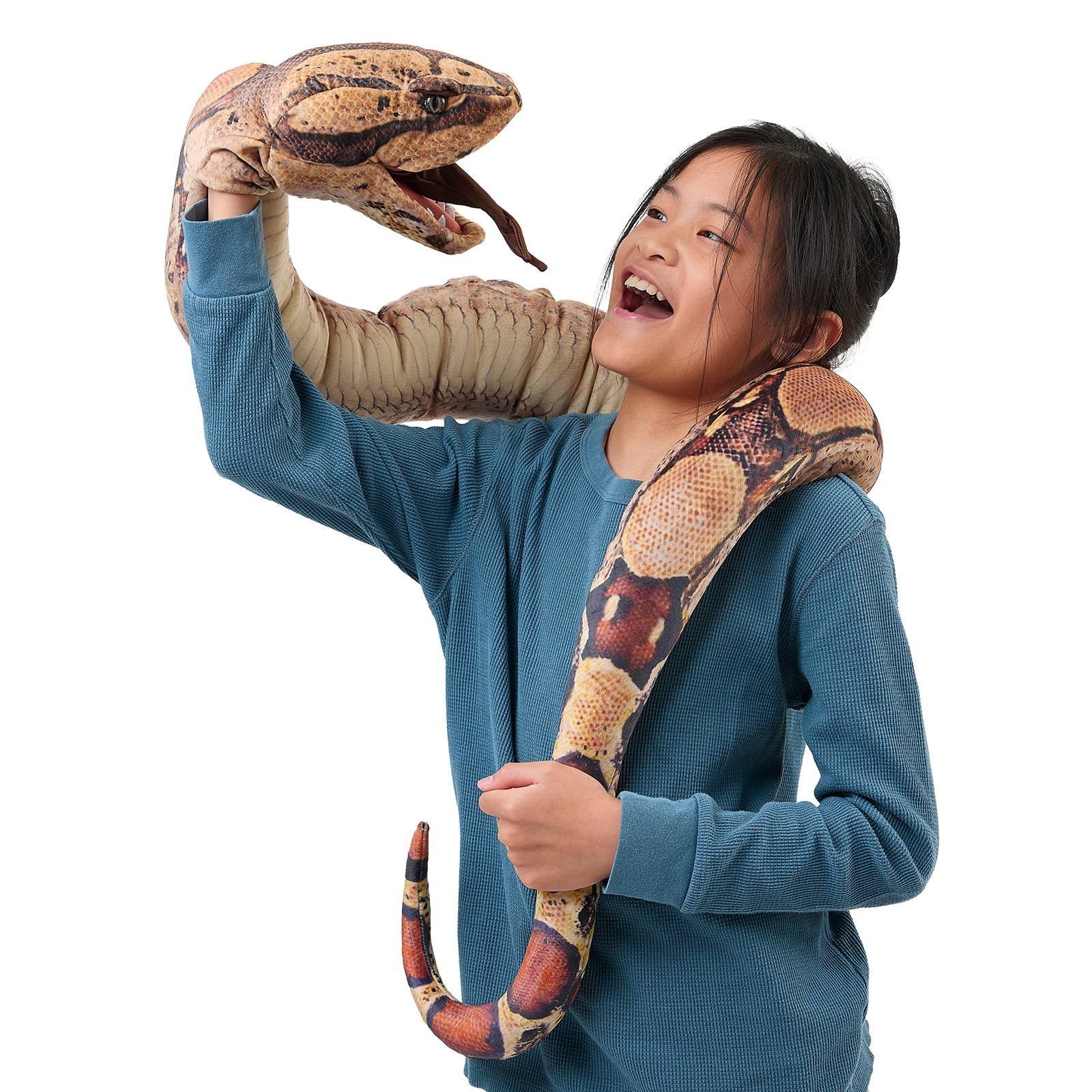Folkmanis boa constrictor hand puppet held up on a girl's arm, mouth open, its body draped around her shoulders.