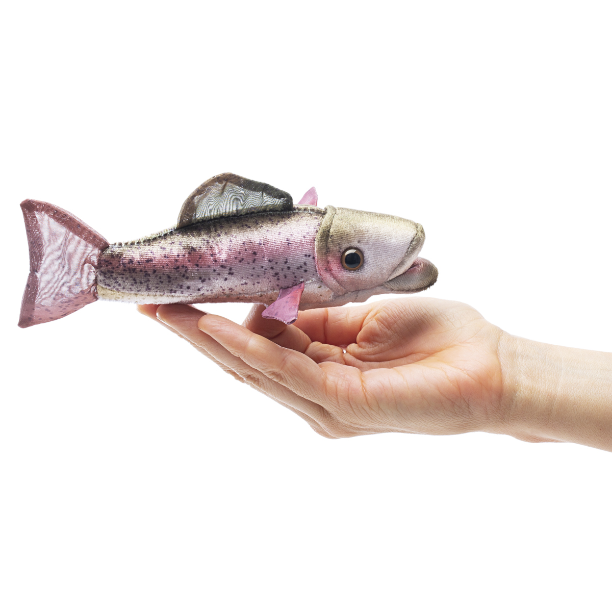 Folkmanis mini rainbow trout finger puppet resting on a palm, silvery-pink fabric with black spots and a transparent tail fin
