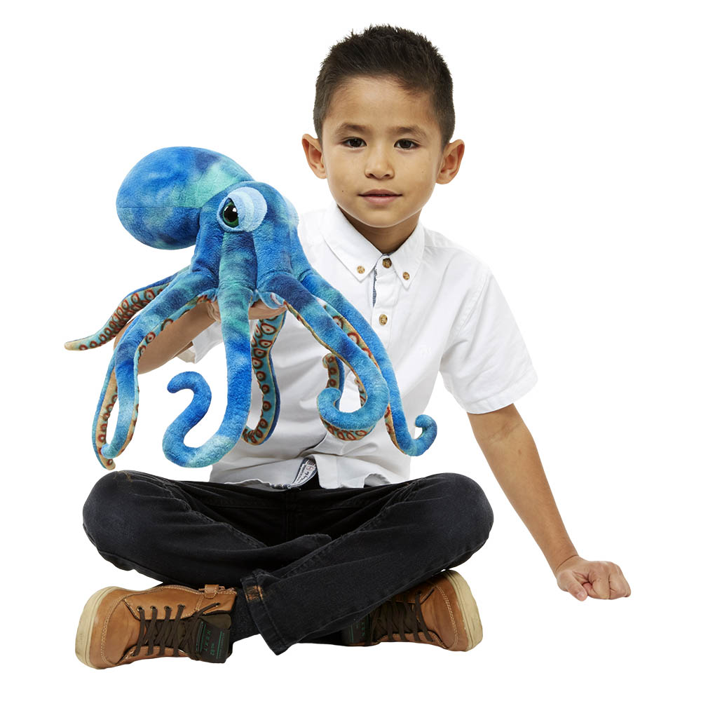 Boy holding the The Puppet Company octopus hand puppet on his hand, usage example