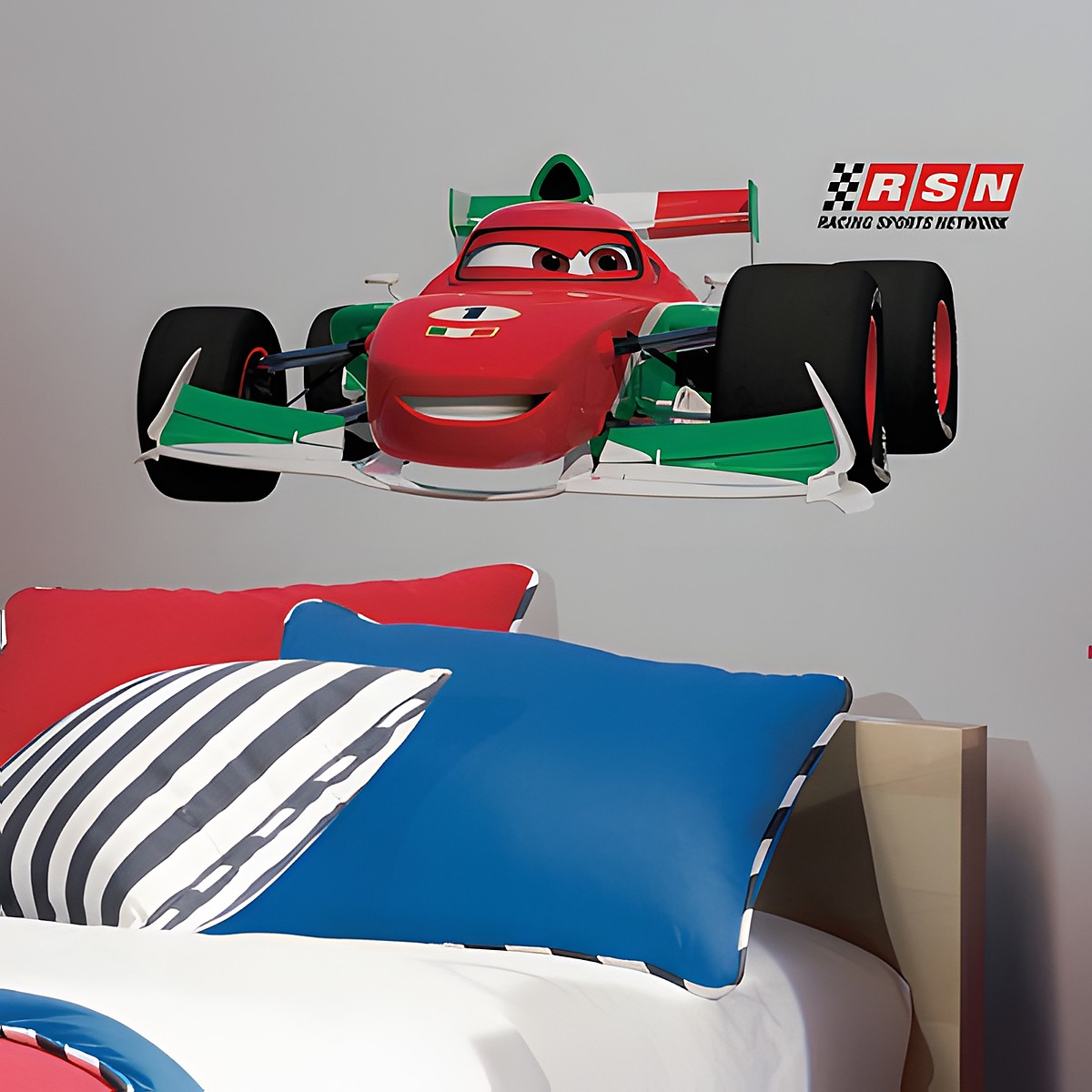 RoomMates wall decal Disney Pixar Cars Francesco Bernoulli, red and green race car on a white children's room wall above a bed with striped pillows