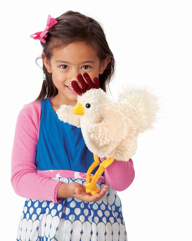 Girl operating the Folkmanis Funky Chicken hand puppet with cream plush, red comb, and yellow legs