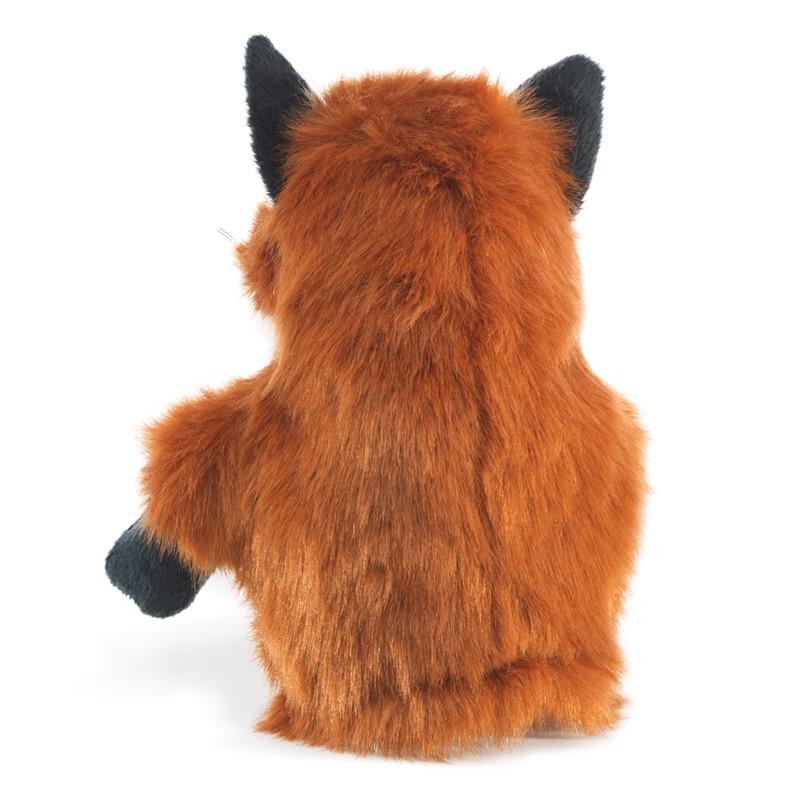 Folkmanis Little Fox hand puppet seen from behind: rust-brown long-pile plush with black ear tips and paws