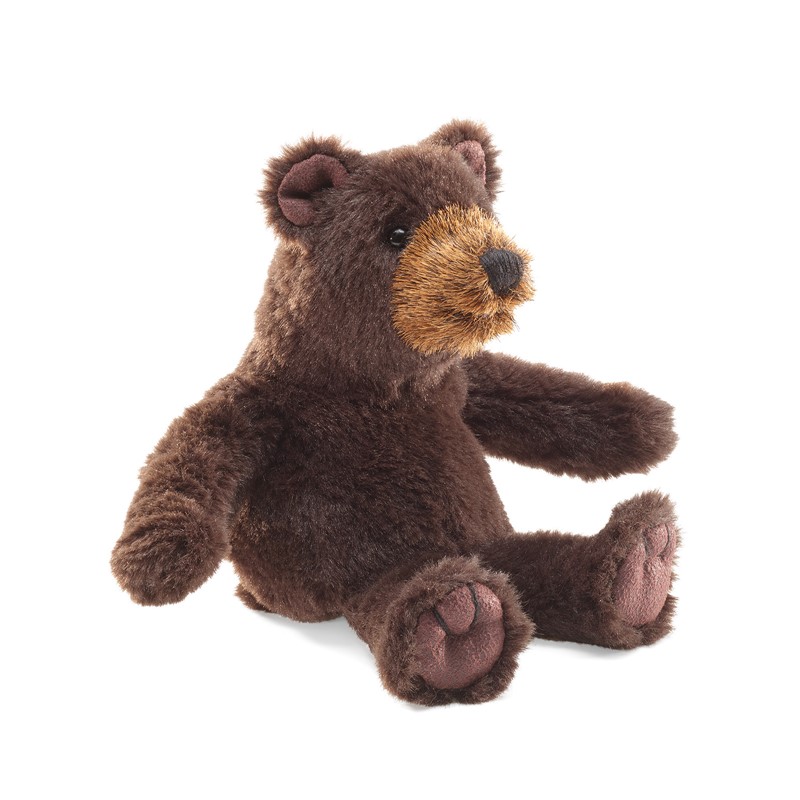Folkmanis mini bear finger puppet in dark brown plush, sitting with a light brown face, shown from a slight angle