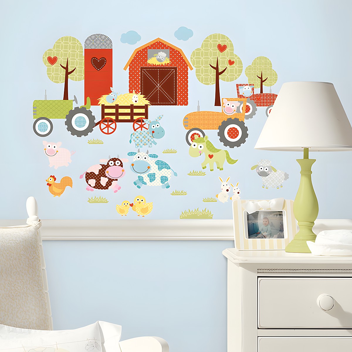 RoomMates wall decal Farmland Animals, colourful farm animals with a barn, tractor and trees on a light blue children's room wall above a chest of drawers