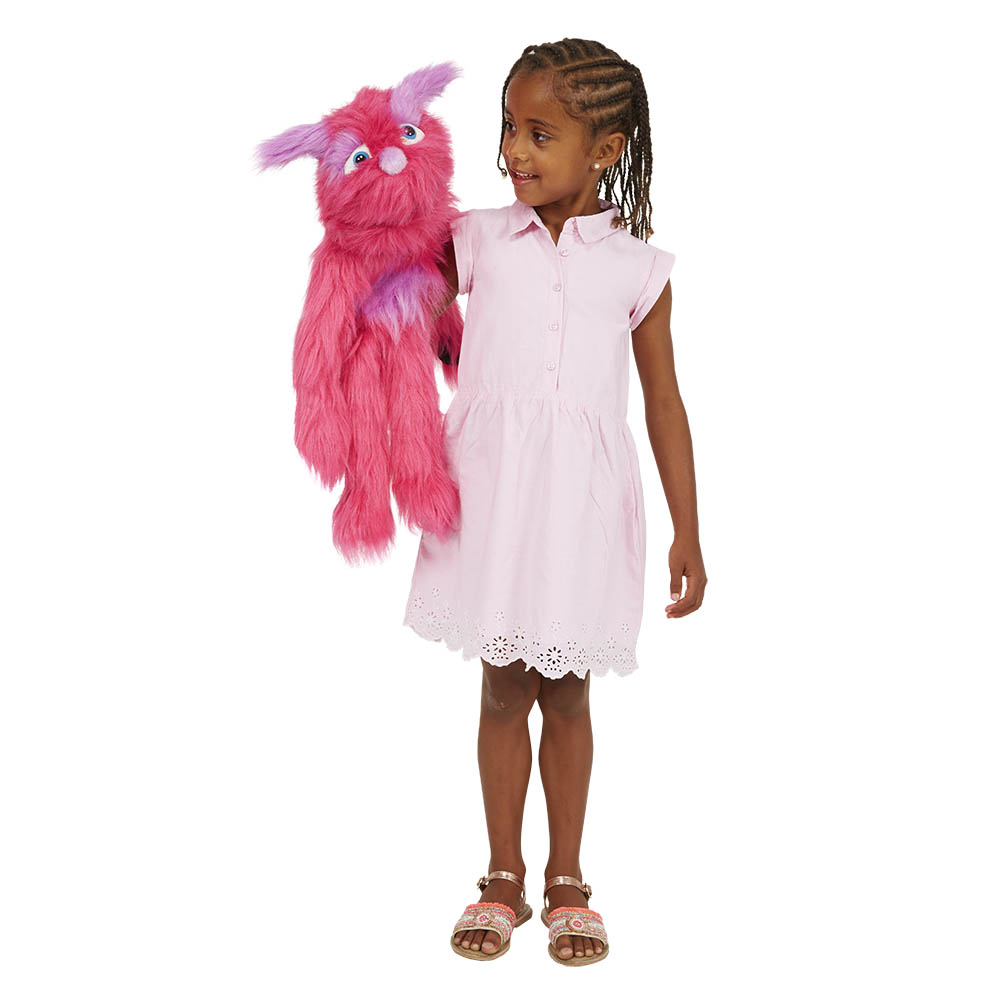 Girl holding the The Puppet Company pink monster hand puppet on her arm, usage example