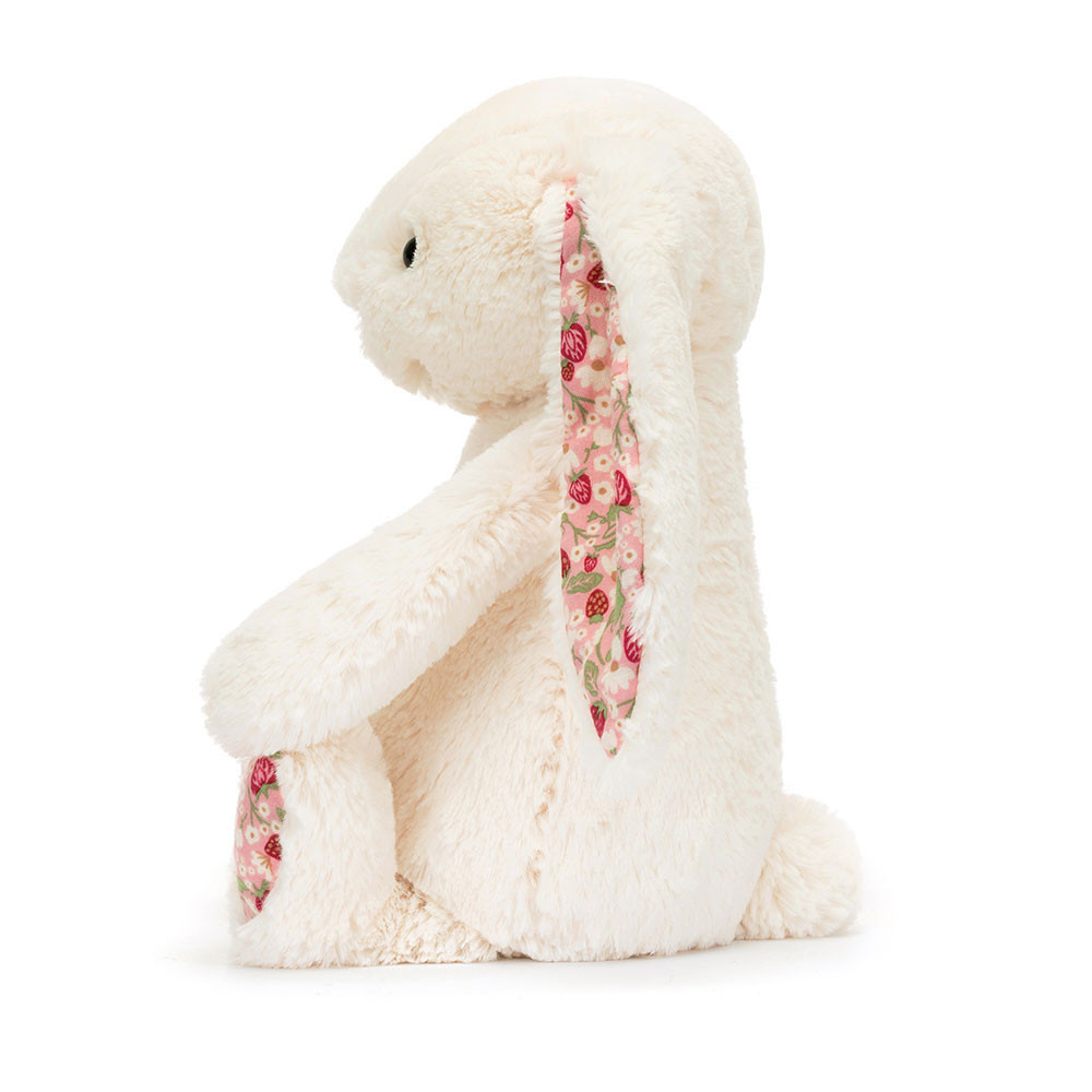 Jellycat Kuscheltier Blossom Bunny Berry Cream, cremefarbenes Hasen-Plüschtier mit rosa geblümten Ohreninnenseiten, Seitenansicht